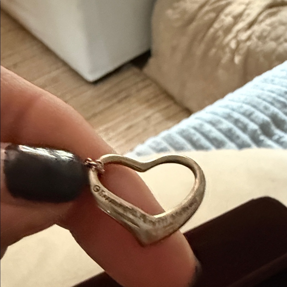 Tiffany&Co. Elegant Silver Heart Pendant

Elsa Peretti®
Open Heart Pendant